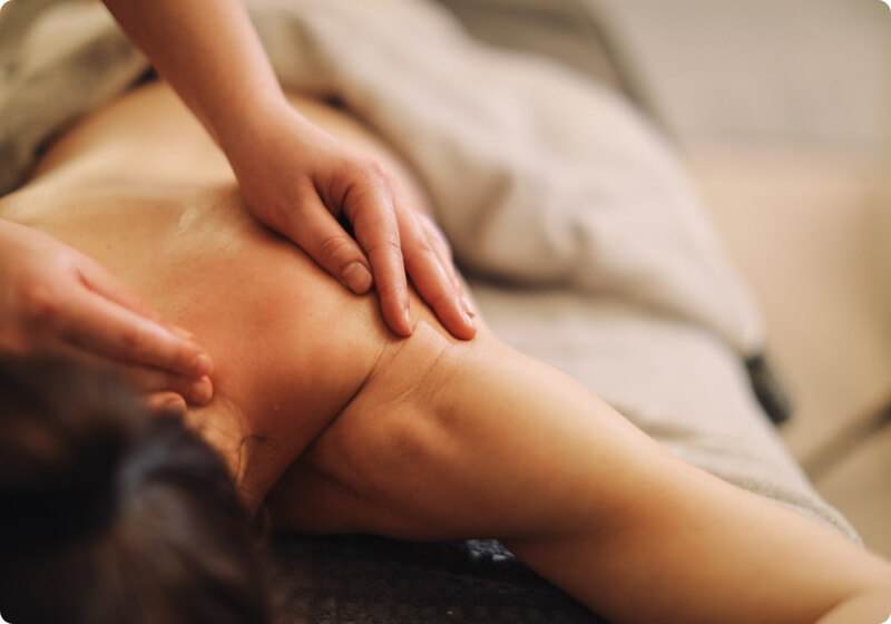Lady receiving a shoulder massage